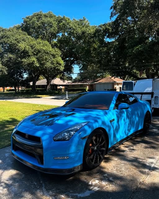 Custom blue Nissan GT-R with a mirror finish after paint correction